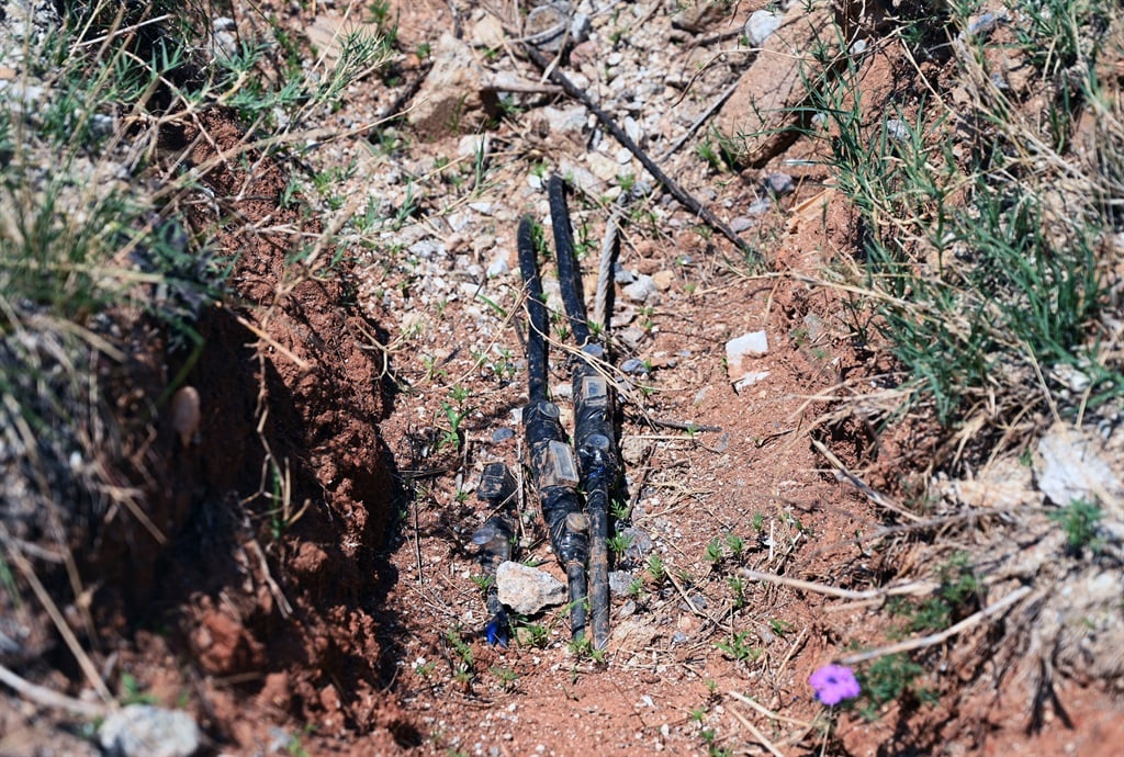 Exposed electrical cables remain uncovered