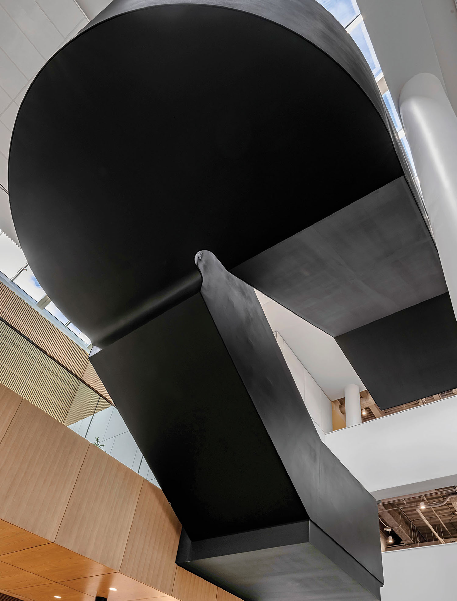 A large black sculpture in a building