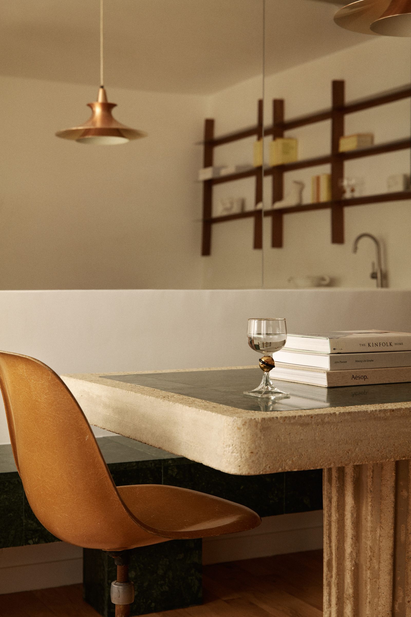 Green marble table and cement leather mirror wall.
