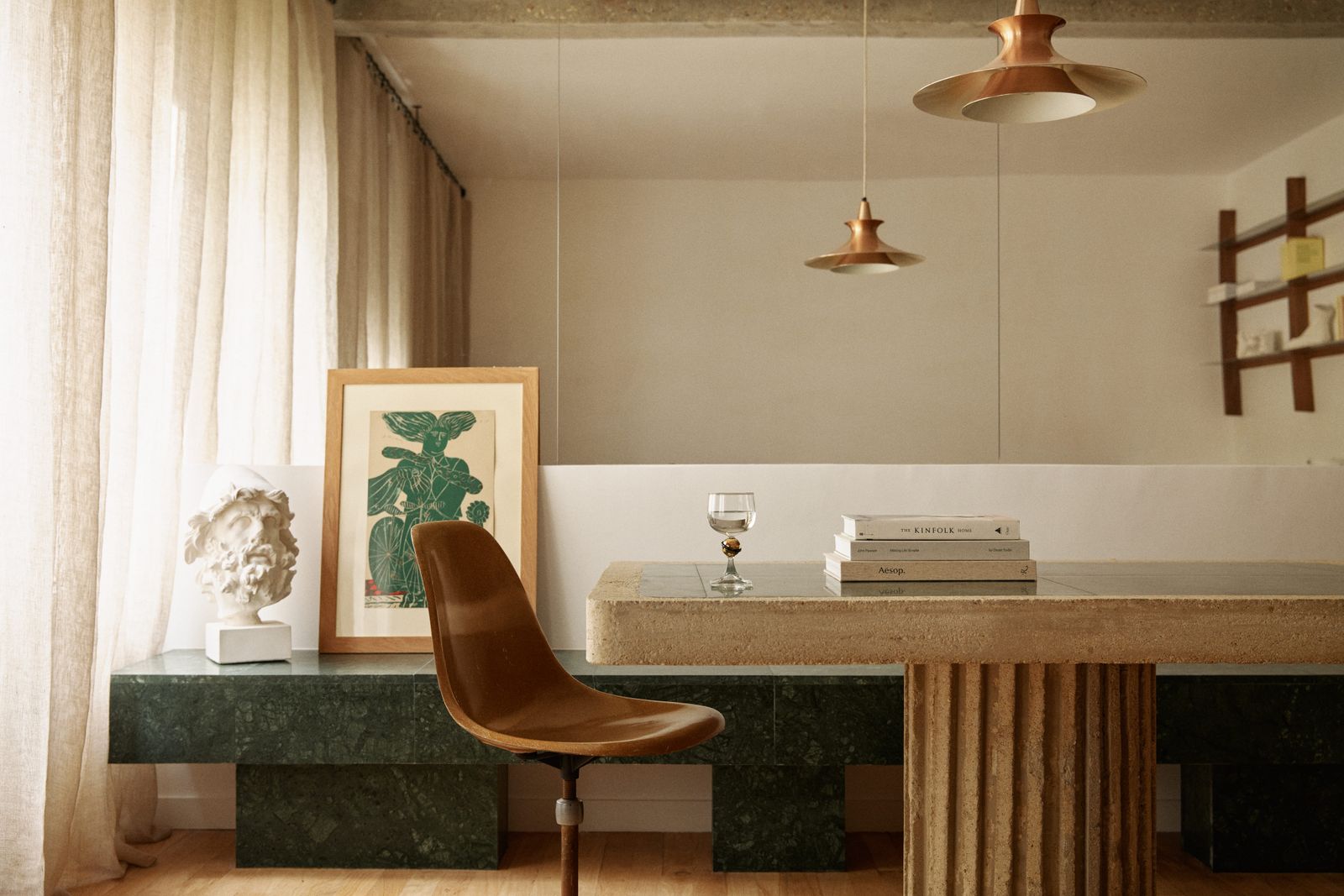 Small apartment in Paris leather chair in the concrete table painted wall reflected wall in green leaf green marble.