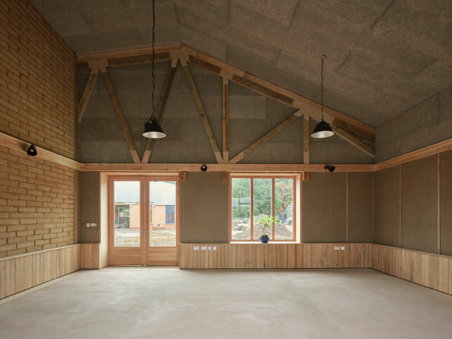 Wolves Lane Center interior of the room made of brick, earth and wood