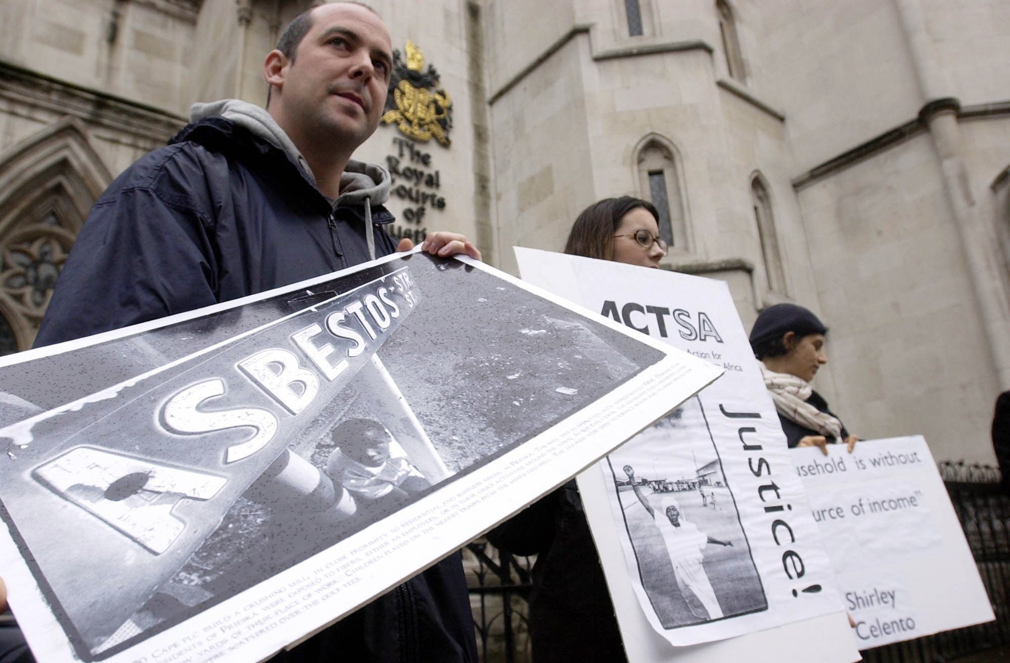Demonstrators outside the High Court in London demonstrate against Cape PLC because they did not pay asbestos mining damage.