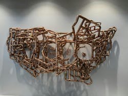 Artist Michael Murphy created an installation transforming Viega ProPress fittings into a floating image of the United States. The piece is located in the new Ohio facility lobby. From head on, you can see the name 'Viega' spelled out. From the right, it forms the state of Ohio.