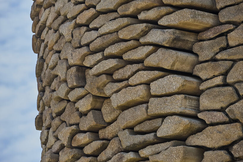 Kinetic sculptures outlined the face into the tower's masonry in the French theme park.
