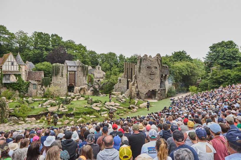 Kinetic sculptures outlined the face into the tower's masonry in the French theme park.