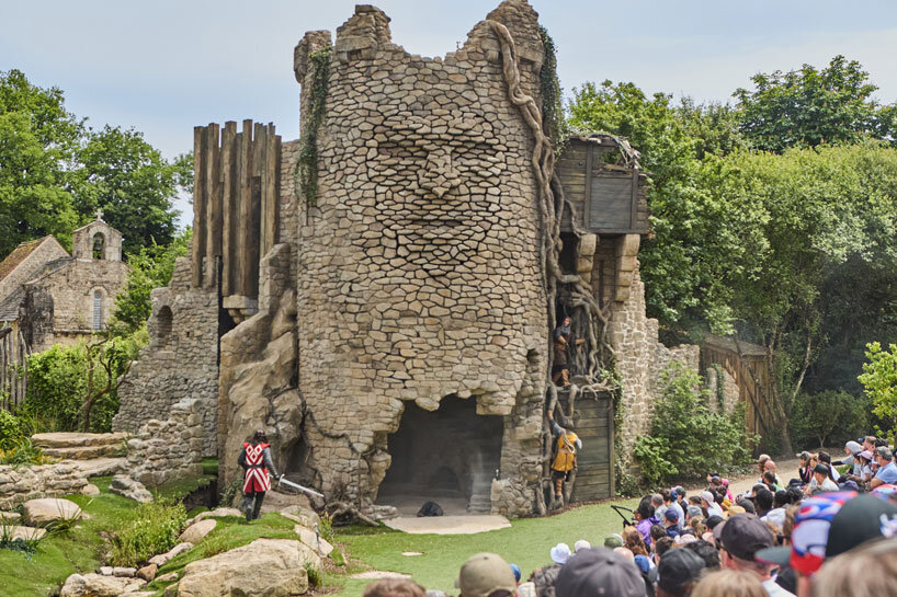 Kinetic sculptures outlined the face into the tower's masonry in the French theme park.