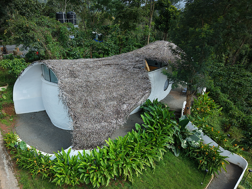 Organic straw and clay shell roof, sculptural eco retreat in India