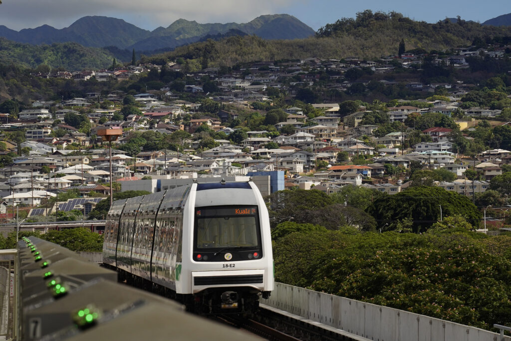A Skyline commuter enters the Hālawa Aloha Stadium station in Honolulu on Thursday, Oct. 9, 2025. (Kevin Fujii/Civil Beat/2025)