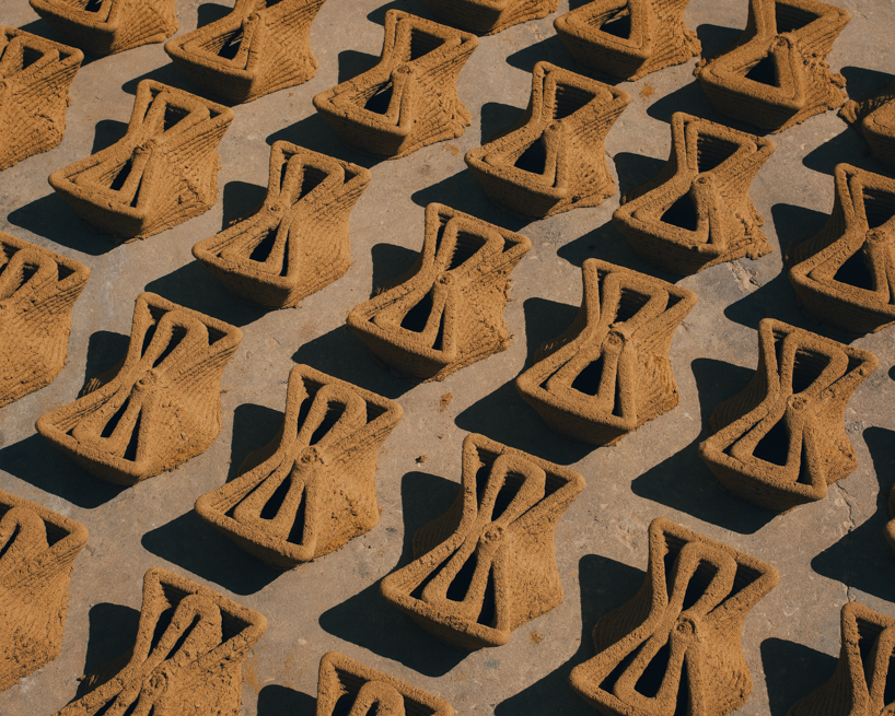 3D printed interlocking bricks form an earthen microclimate shelter for tree seedlings