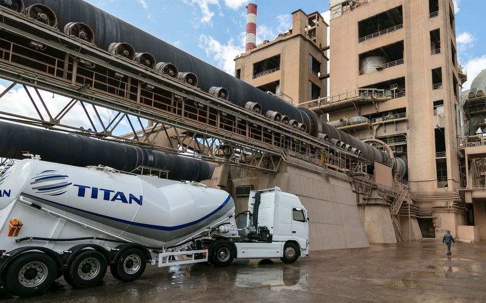 S&P revises Titan Cement outlook to positive due to strong performance.
