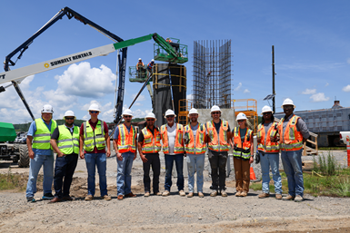 Group photo in front of the Janus Gate project