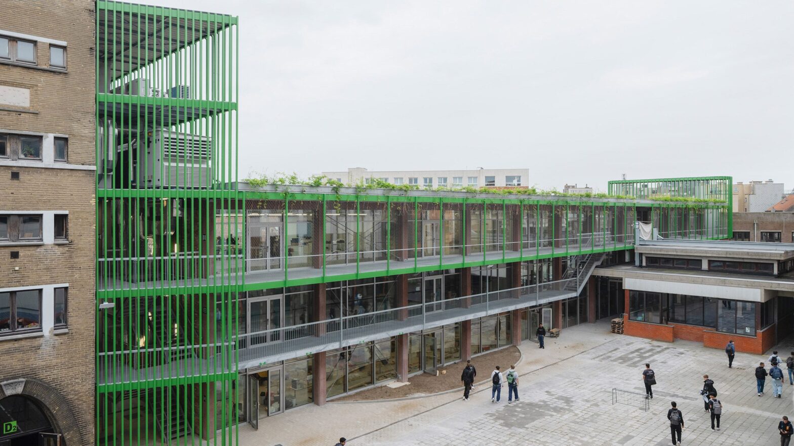 Bright green staircase bookend Atelier PPW Workshops in Belgium
