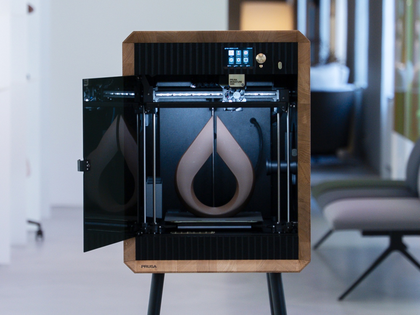 Prusa is introducing two new 3D printers in the Core One series and one of them features an oak housing
